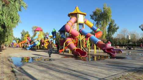 children play in the public park - time laps