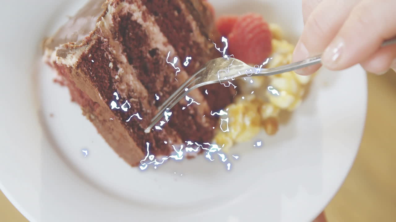 Spoon touching cake slice with electric sparks animation over dessert plate