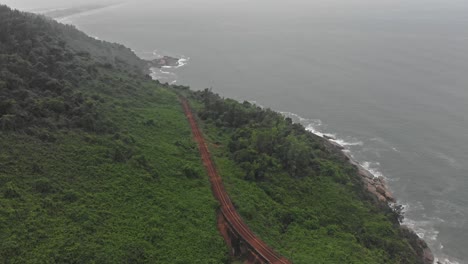 Drone-view-of-beautiful-Vietnam-coastline-at-Hai-van-pass,-aerial