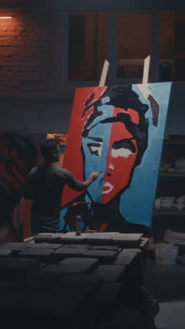 artist painting a portrait in a studio