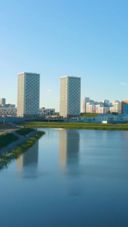 cityscape with apartment buildings and lake