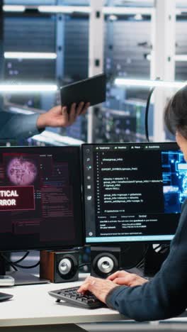 vertical video data center manager coordinates programmers fixing critical error while using ai