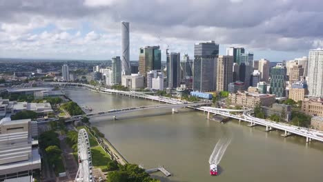 panorama of brisbane city, boat sailing on river, australia