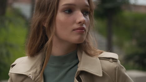 Caucasian-woman-looking-at-the-camera-outdoors.