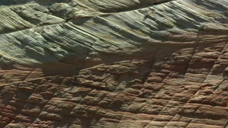 geological strate in sandstone erosion pattern at zion national park