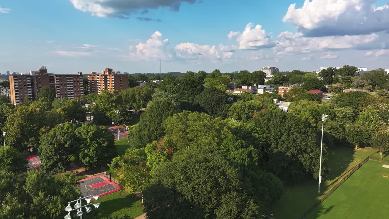 Basketball court, urban green park with Atlanta city skylines in view, Central Park, Georgia, Aerial