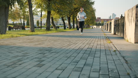 man running in a city park