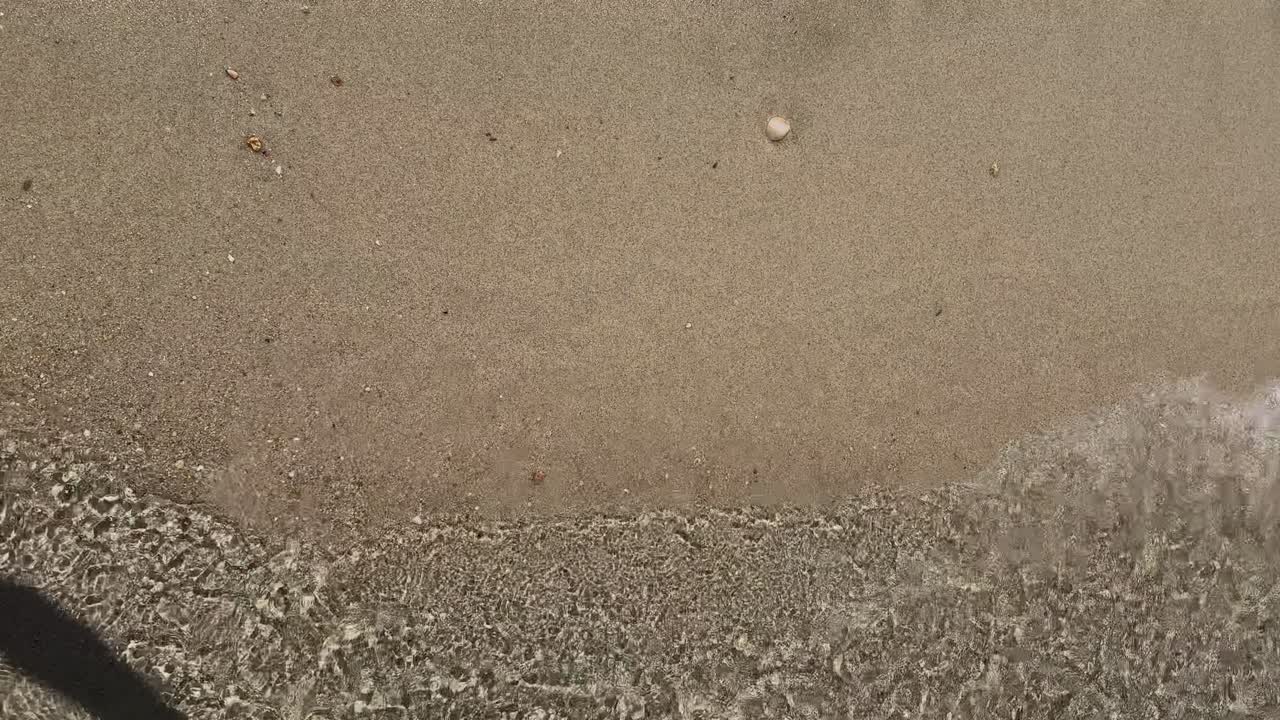 Stunning beach scene in Halkidiki, Greece, with elegant sunbeds facing the crystal-clear turquoise sea. A perfect summer escape in the heart of the Aegean.