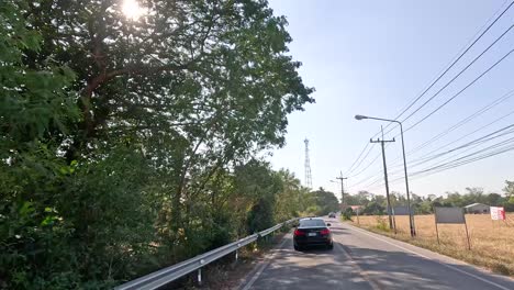 a peaceful drive through lush, rural thailand