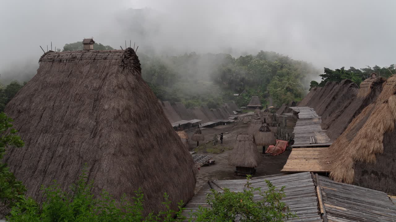 Traditional Village Shrouded in Mist