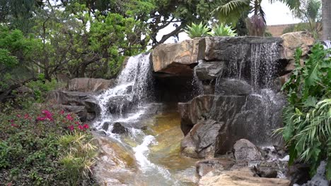 waterfall on rocks in a pond