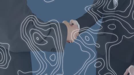 animation of moving shapes over caucasian business people shaking hands