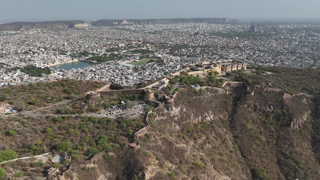 Scenic drone capture of the steep, rocky terrain surrounding the ancient fort walls.
