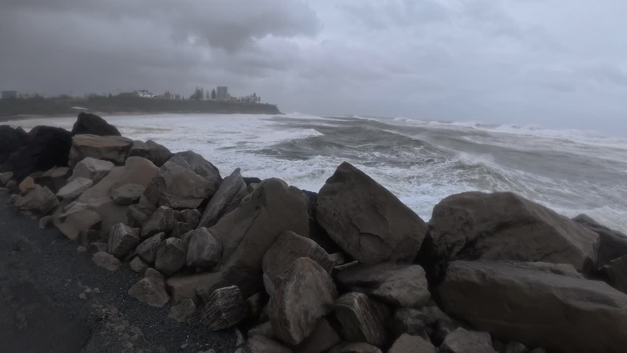Dark Clouds Over Huge Waves During Cyclone Alfred In NSW, Australiaa. - wide shot
