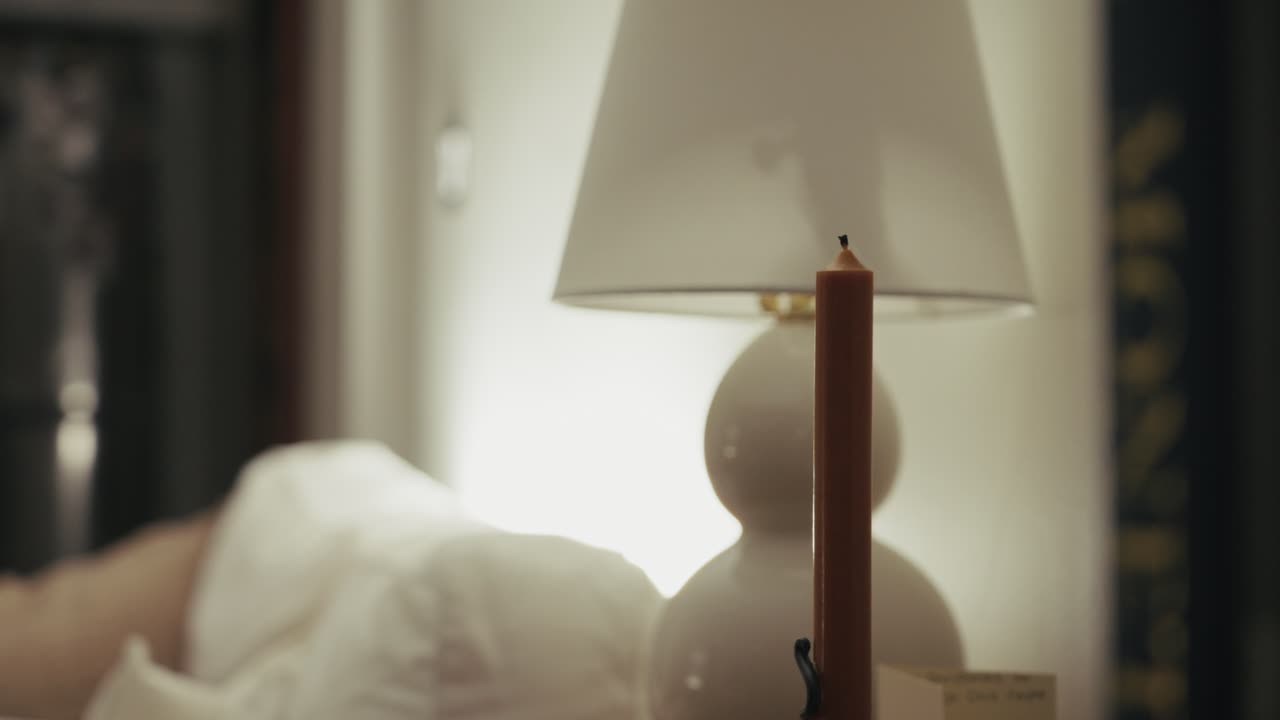 Candle extinguished in cozy room, peaceful ambiance, dim lighting