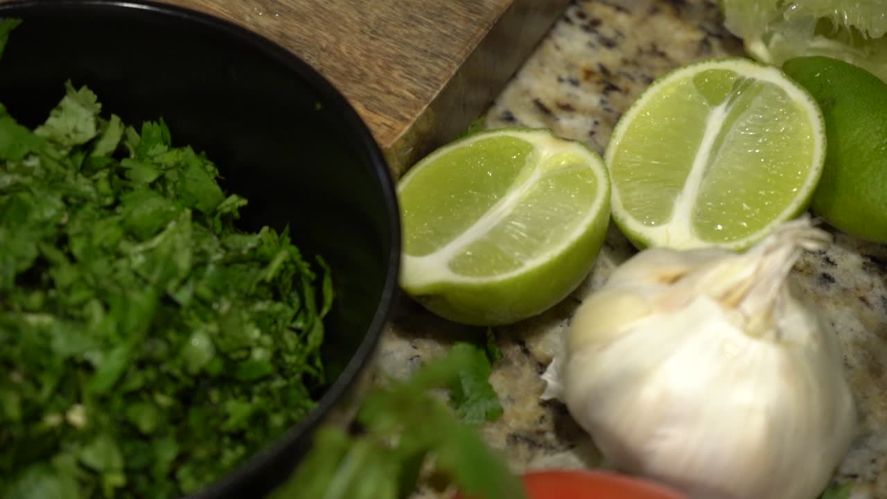 A Layout of Fruits and Vegitables on a Kitchen Counter in Slow Motion.