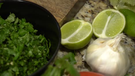 a layout of fruits and vegitables on a kitchen counter in slow motion.