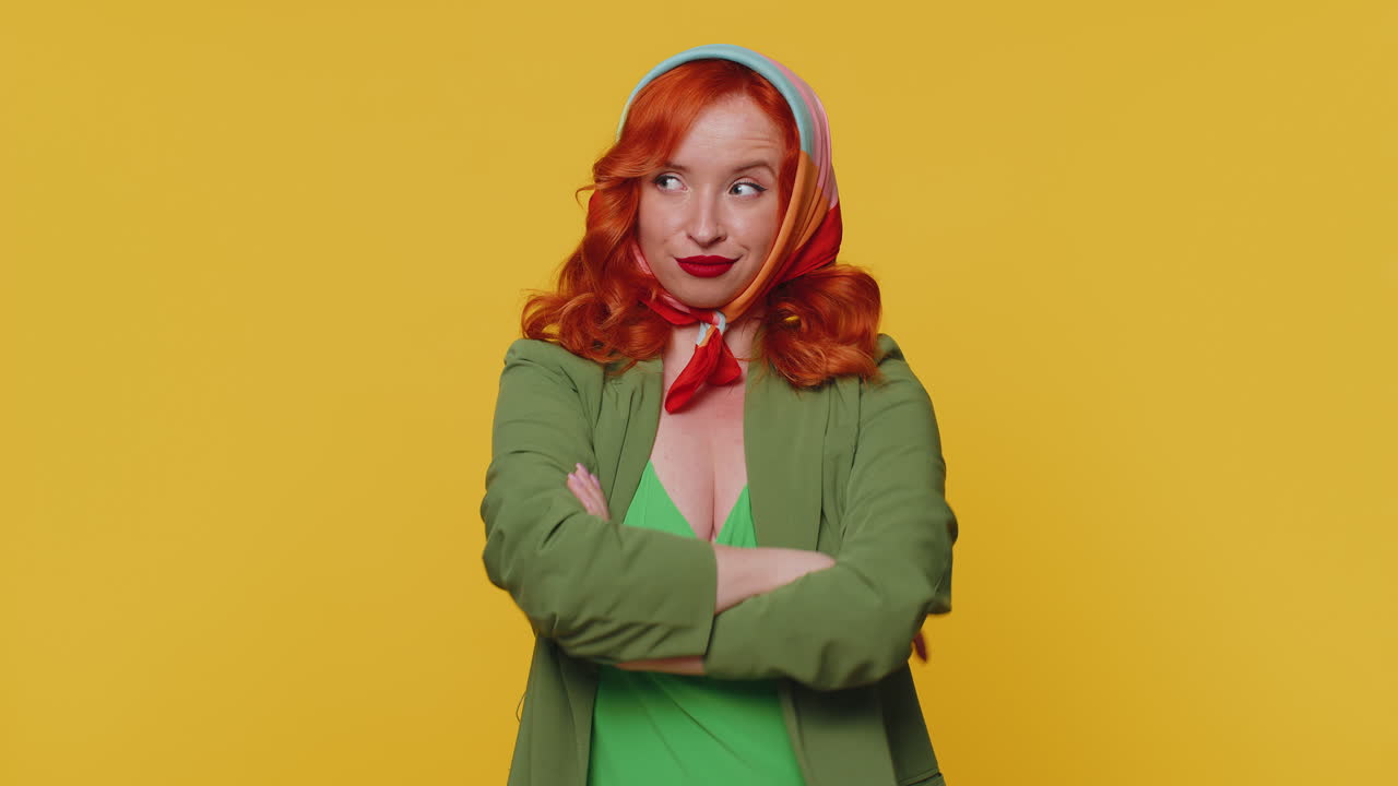Funny ginger girl making playful silly facial expressions, grimacing, fooling around showing tongue