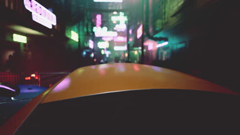 a nighttime view of a neon-lit street