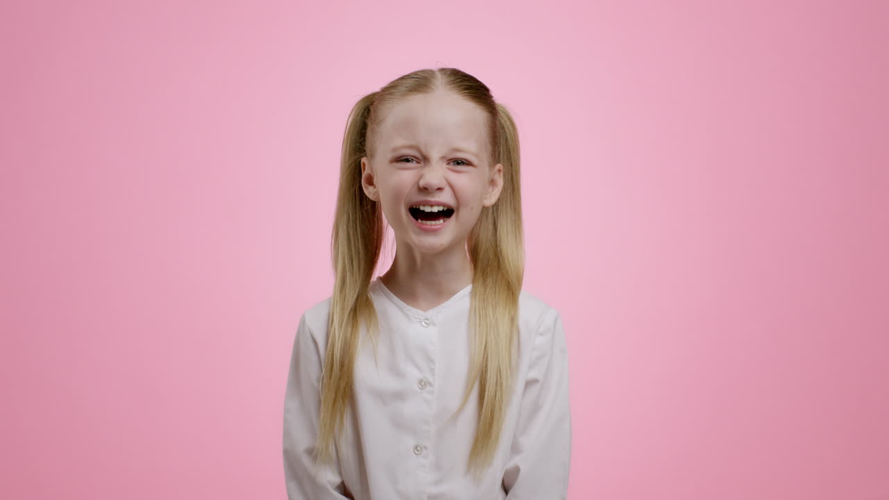 Girl with pigtails smiling