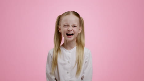 girl with pigtails smiling