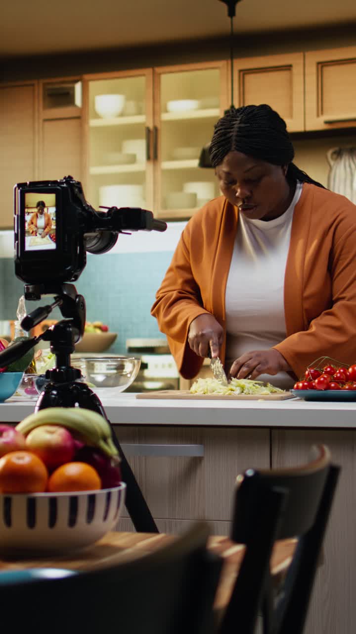 Vertical Video Woman influencer chef recording a food vlog and cutting iceberg salad