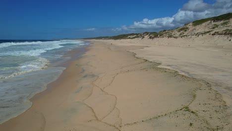 sandy shore of mungo beach in new south wales, australia - drone shot