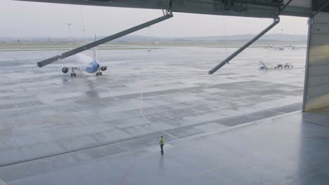 airplane at airport hangar