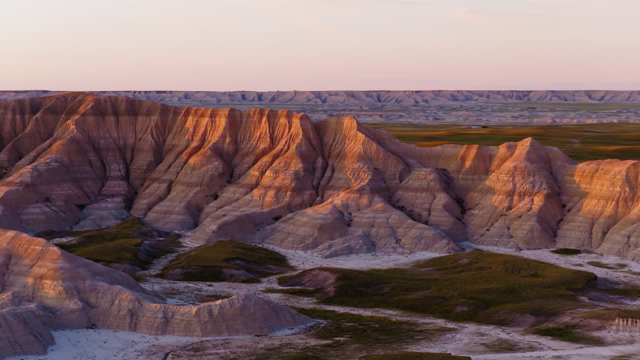 Drone Over Rugged Badlands Terrain With Stunning Evening Sky Colors