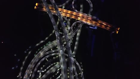 top down aerial view of night traffic on roads in guangzhou, china. illuminated roads and cars. high angle drone shot