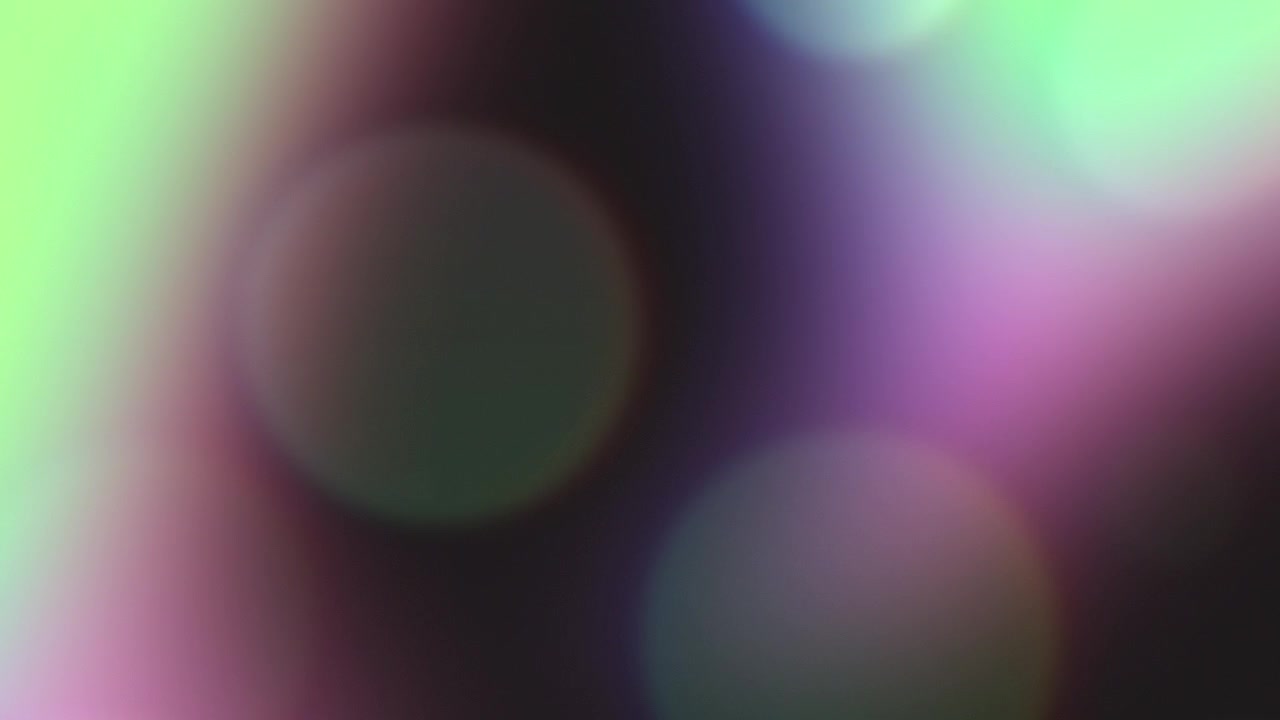 Abstract Background with Soft Glowing Pink and Green Bokeh Lights