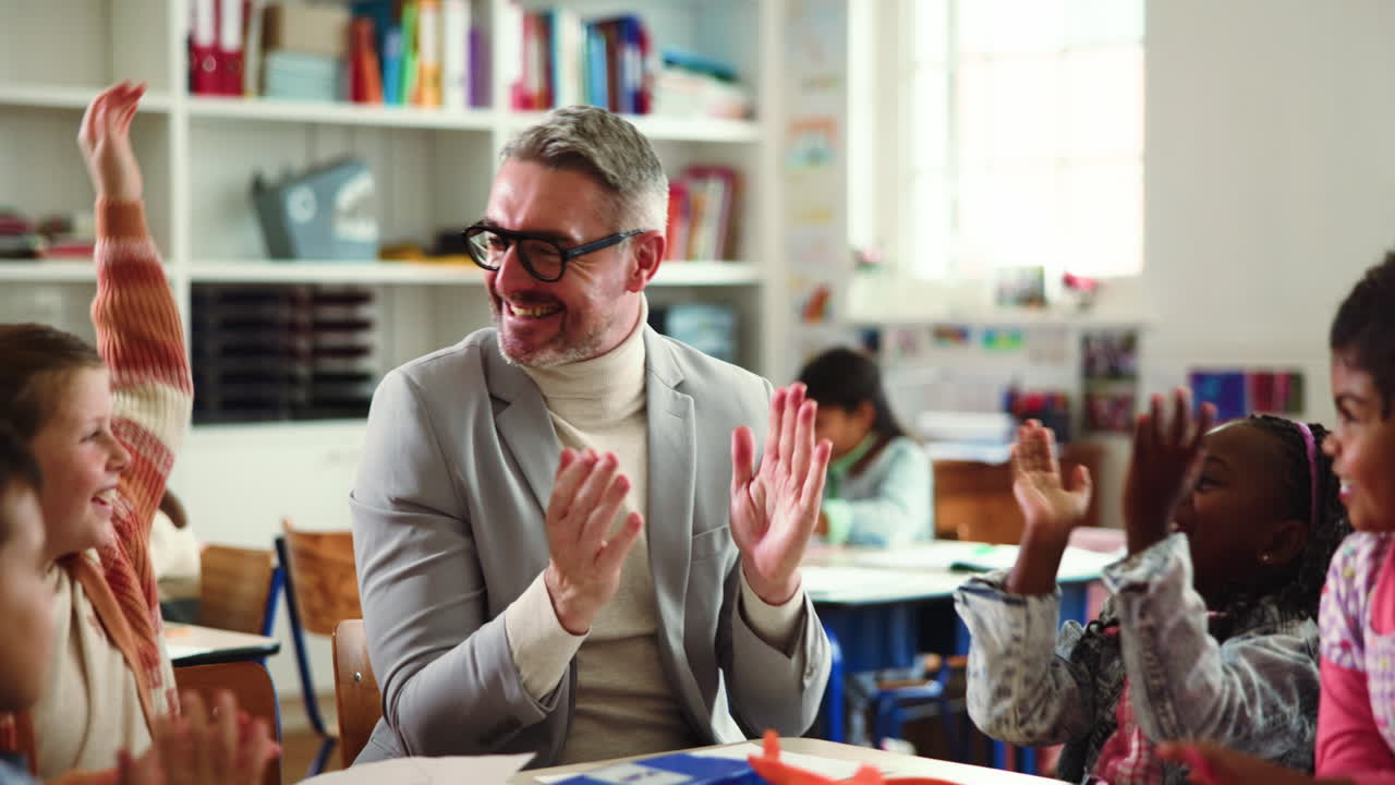 Teacher and Students Clapping in Classroom