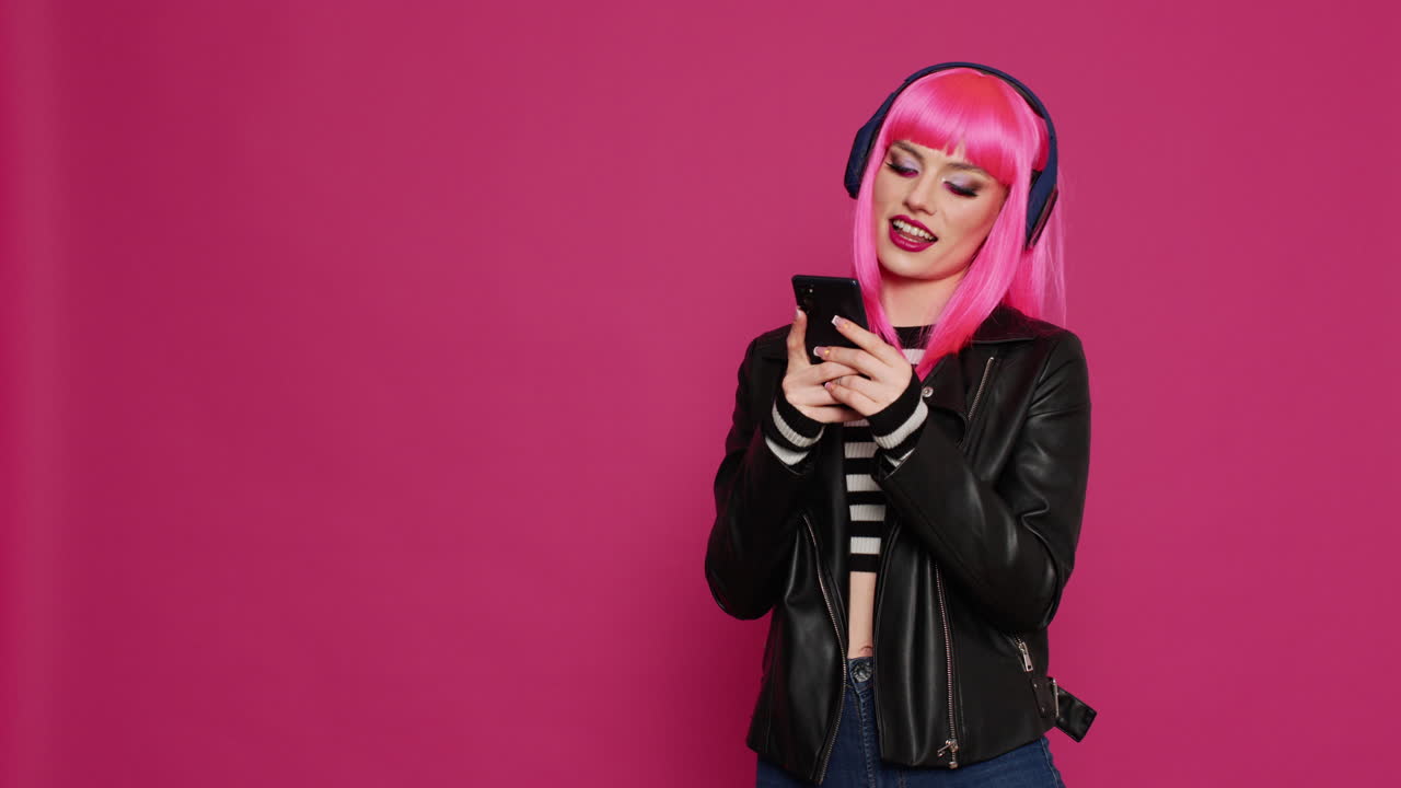 Sexy beautiful woman texting messages and listening to music