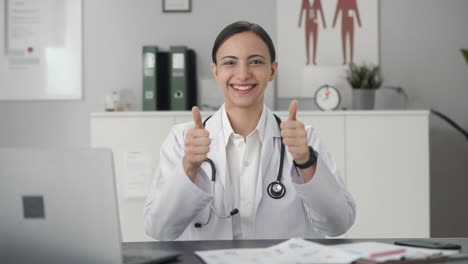 happy indian female doctor showing thumbs up