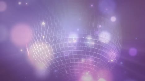 digitally generated video of glowing spots and disco mirror ball moving against purple background