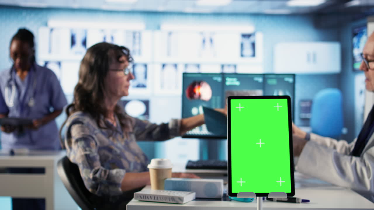Vertical Video Old general practitioner consulting a female patient next to chroma key space