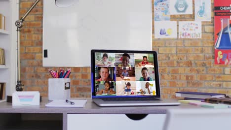 Group-of-school-children-learning-displayed-on-laptop-screen-during-video-call