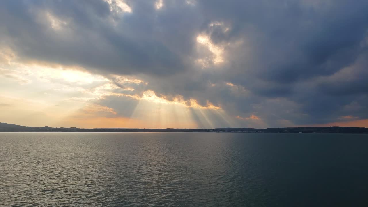 Sunset at sea with heavenly rays