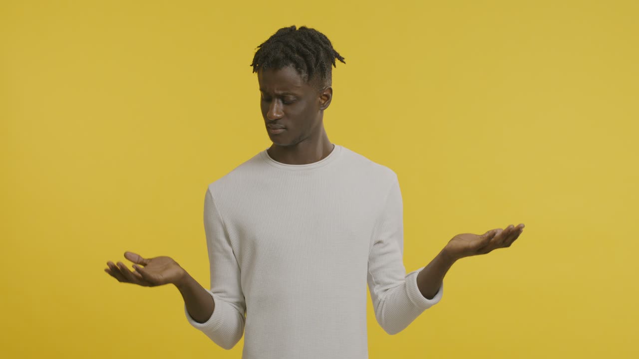 Man in indecisive pose