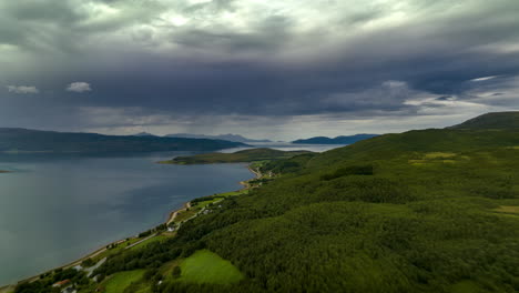 forested lake mountains at malangen fjord in troms og finnmark county, norway