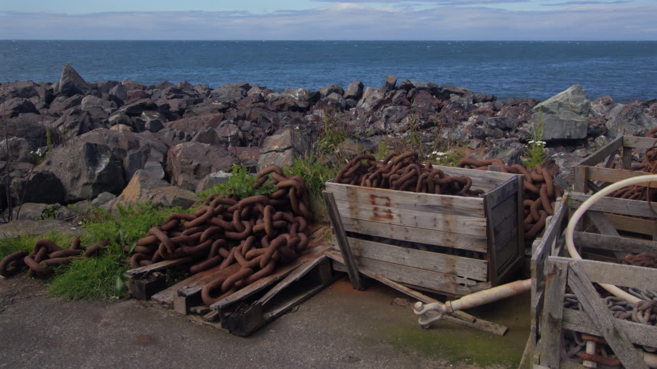 shot of rusting anchor chain on the harbour quey at port Patrick Marina