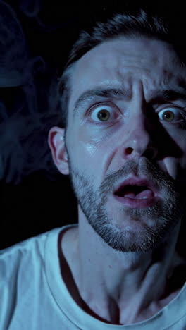 Close-up of a scared man's face