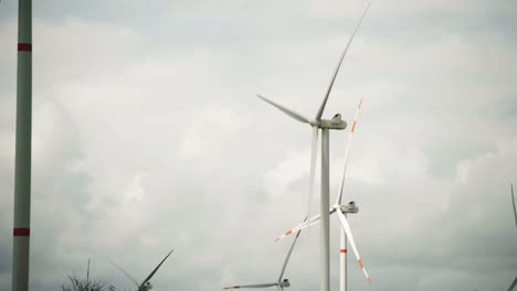 clouds over wind turbines in a wind power farm in mexico, establishing shot