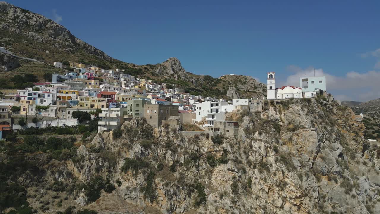 Aerial View of a Colorful Village on a Cliffside in Greece