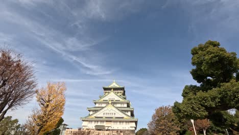 time-lapse view of osaka castle with changing trees.