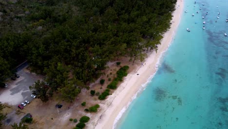 aerial view of a tropical beach with turquoise water