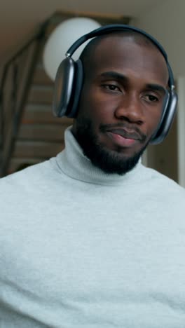 man working from home with headphones