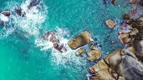 beautiful rocky coast and rough sea waves crashing on the stones