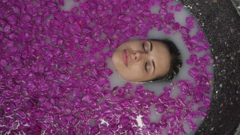 woman enjoying a floral milk bath