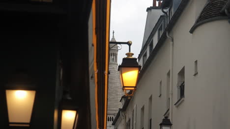 street in paris with sacré-cœur basilica in background